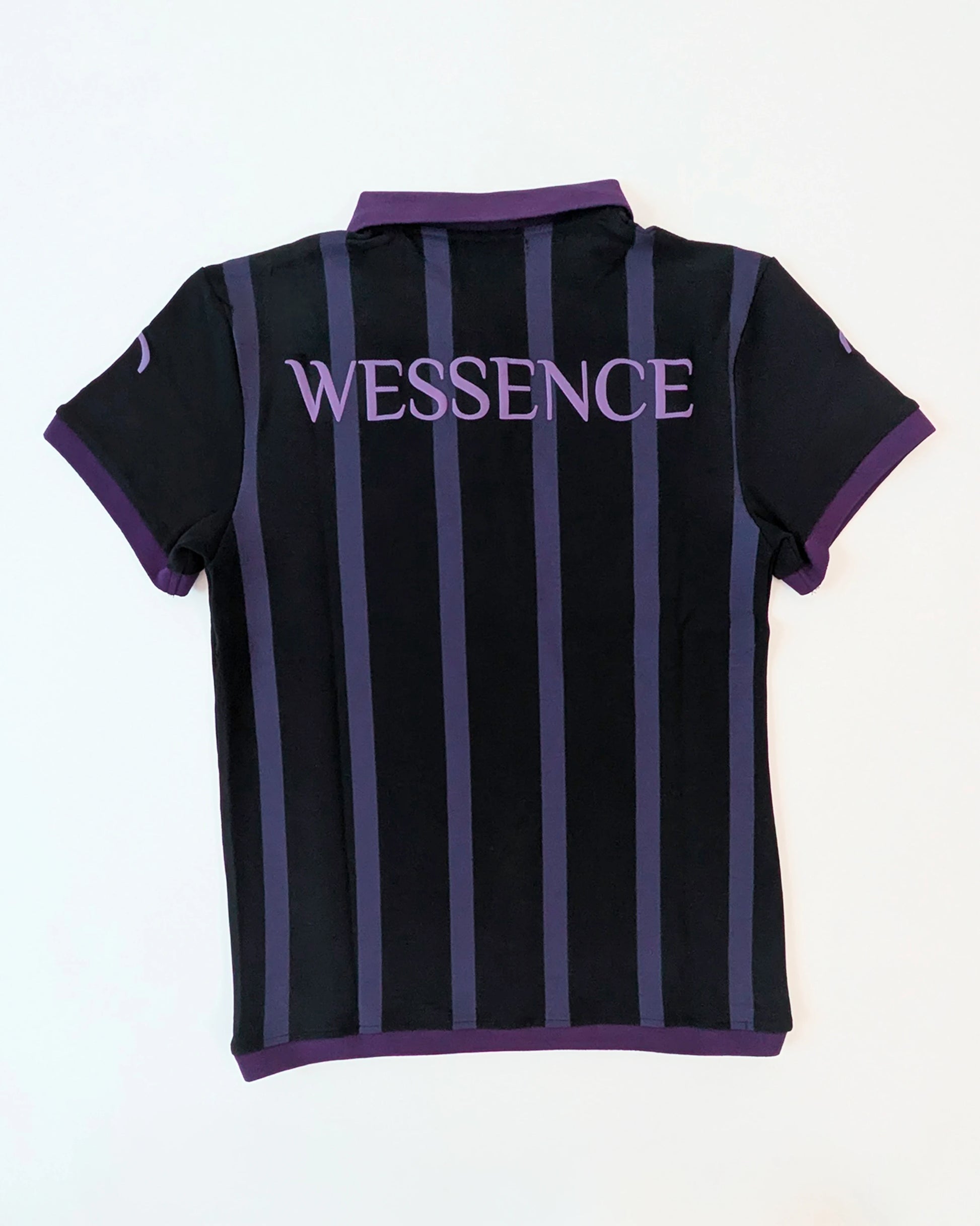 Back view WESSENCE ENIGMA black and purple striped polo shirt, neck logo detail, urban chic style.